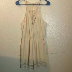 Dainty Hooligan- cream colored one-piece jumpsuit outfit with lace and pockets